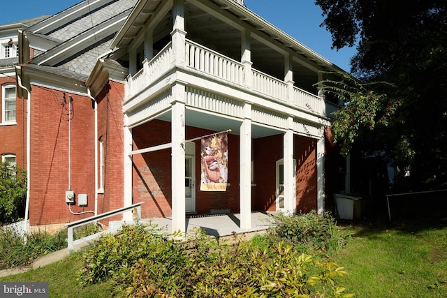 130 E Linn St, Bellefonte, PA 16823 - exterior space featuring a balcony and brick siding