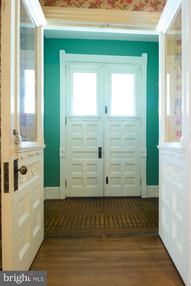 entryway with french doors and dark hardwood / wood-style flooring