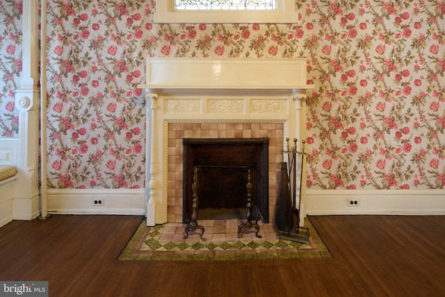 room details with hardwood / wood-style flooring and a tile fireplace