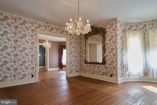 unfurnished dining area featuring wood-type flooring and a chandelier