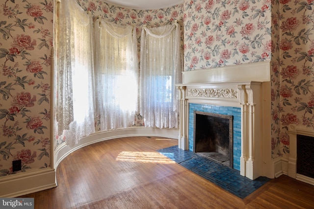 unfurnished living room with hardwood / wood-style floors