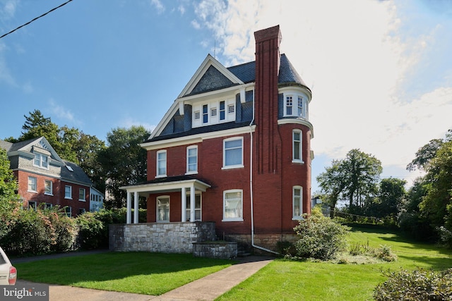 130 E Linn St, Bellefonte, PA 16823 - victorian house featuring a front lawn and a chimney