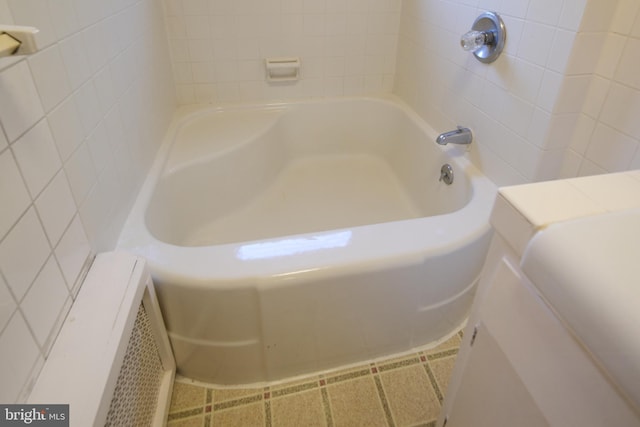 bathroom featuring a tub to relax in