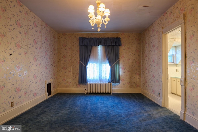 carpeted spare room featuring an inviting chandelier and radiator heating unit