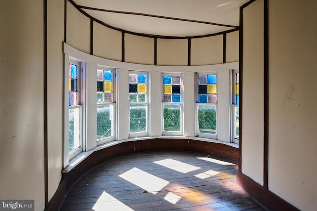 unfurnished sunroom featuring a healthy amount of sunlight