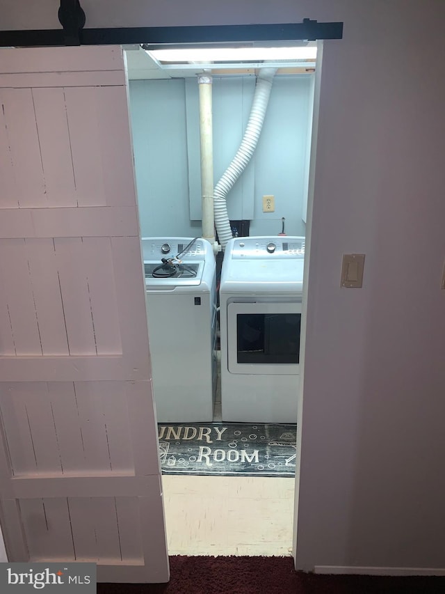 laundry area with washing machine and clothes dryer