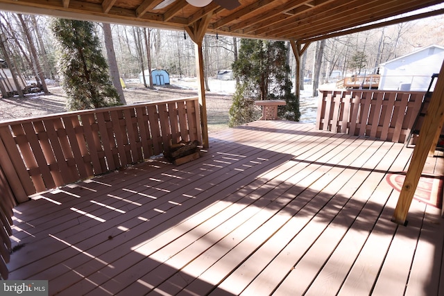 snow covered deck featuring ceiling fan