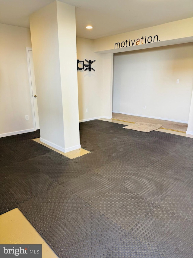 interior space featuring dark carpet