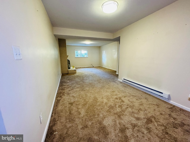 basement with a baseboard heating unit and carpet floors