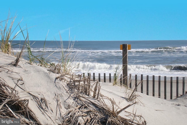 property view of water featuring a view of the beach