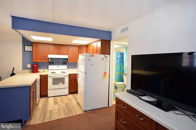 kitchen featuring light hardwood / wood-style flooring, ornamental molding, and white appliances