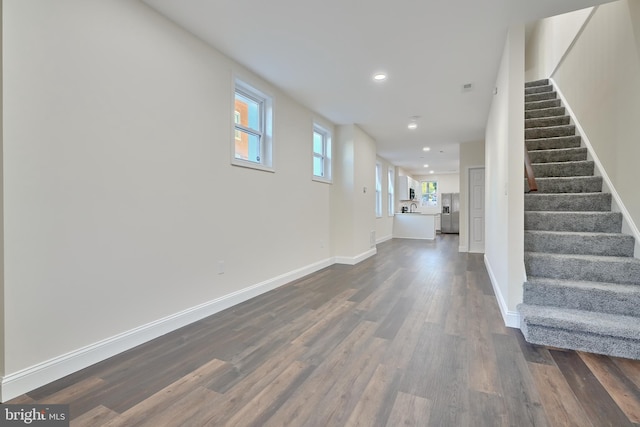 entryway with dark hardwood / wood-style floors