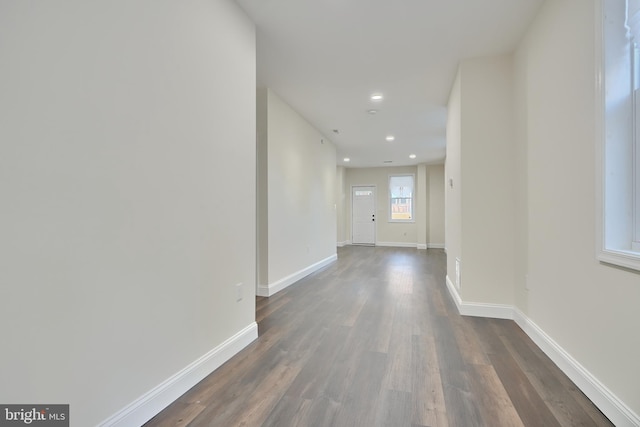 corridor with dark hardwood / wood-style floors