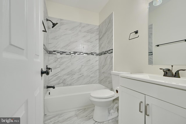 full bathroom featuring vanity, tiled shower / bath, and toilet