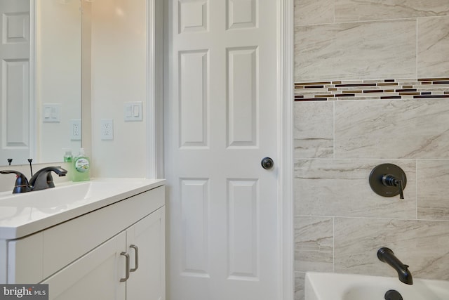 bathroom featuring vanity and separate shower and tub