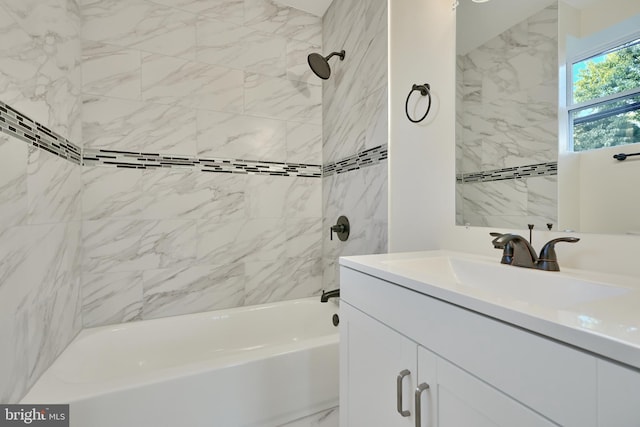 bathroom featuring vanity and tiled shower / bath combo