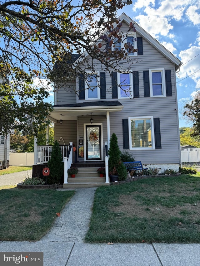 view of front of house featuring a front lawn and a porch