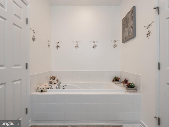 bathroom featuring tiled bath