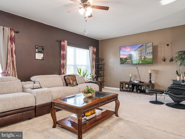 carpeted living room with ceiling fan