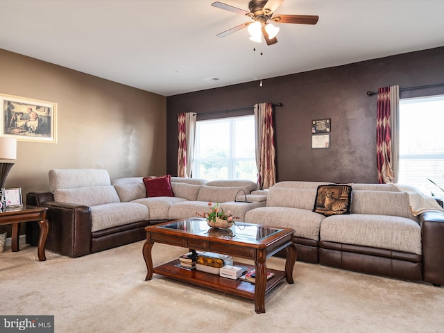 living room with light carpet and ceiling fan