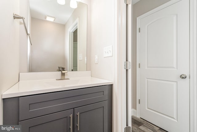 bathroom featuring vanity and hardwood / wood-style flooring