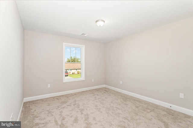 empty room with light colored carpet