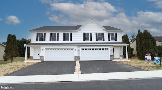 front of property with a garage