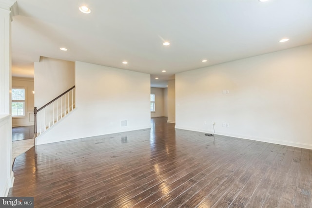 unfurnished room featuring dark hardwood / wood-style floors