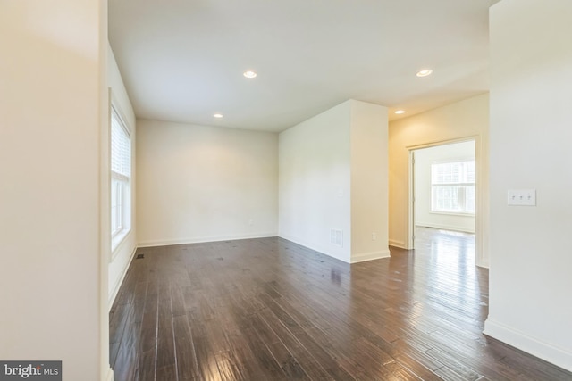 unfurnished room with dark hardwood / wood-style floors