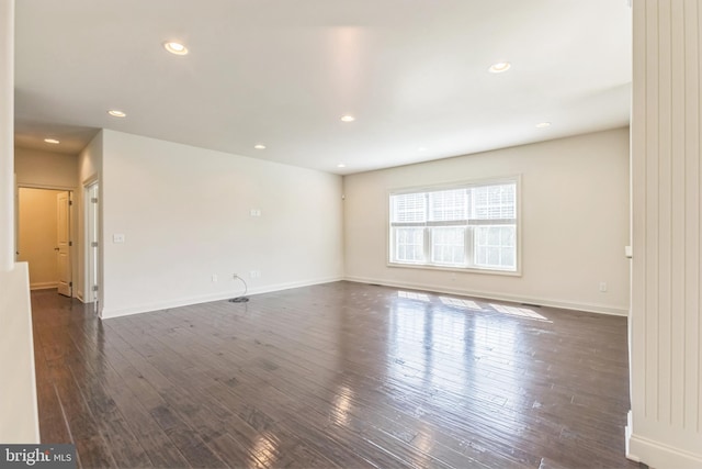 spare room featuring dark hardwood / wood-style floors