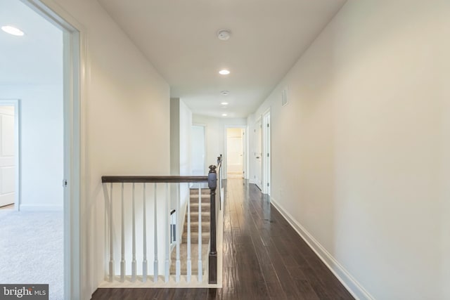 hall with dark hardwood / wood-style floors