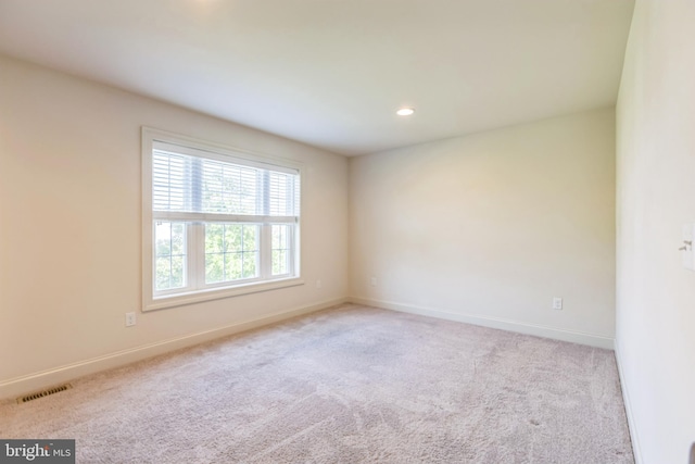 view of carpeted spare room