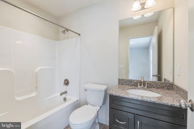 full bathroom with  shower combination, vanity, and toilet