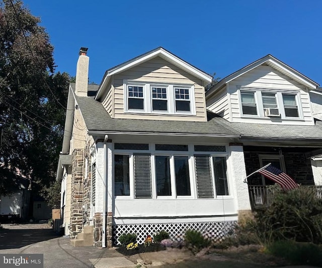 view of front of property with cooling unit