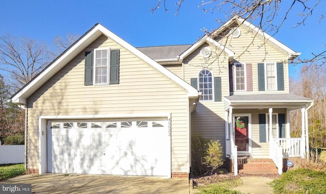 front of property with a garage and a porch