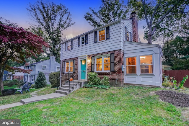 view of front of home with a yard