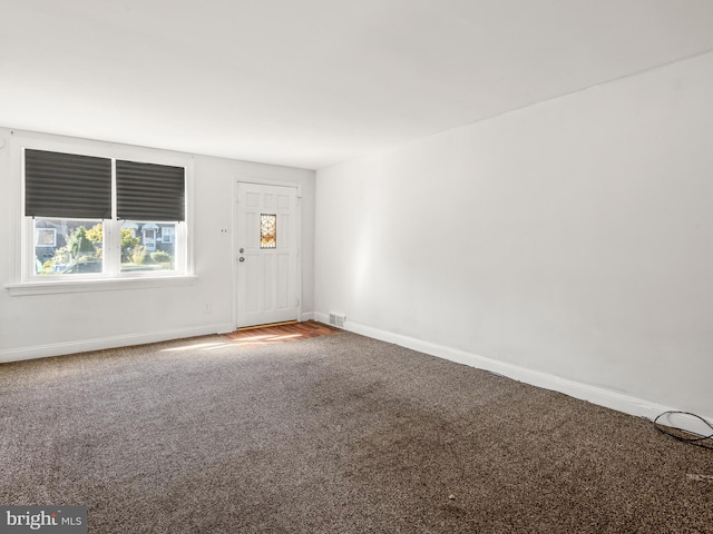 spare room featuring carpet flooring