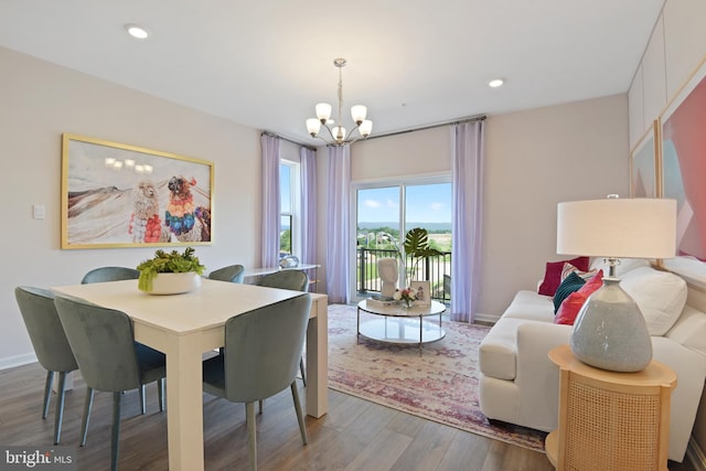 dining room featuring a notable chandelier and hardwood / wood-style flooring