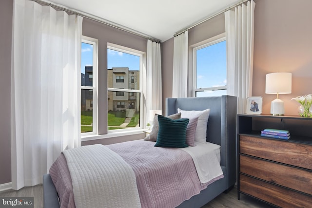 bedroom featuring dark hardwood / wood-style flooring