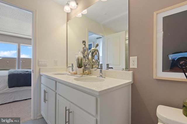 bathroom with vanity and toilet