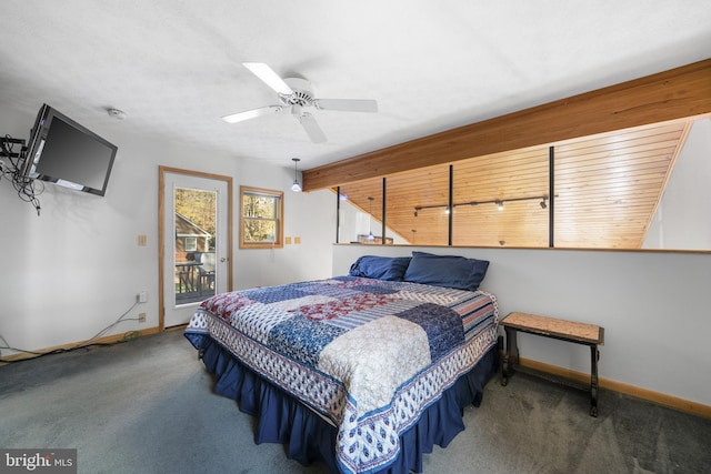 carpeted bedroom featuring access to exterior and ceiling fan