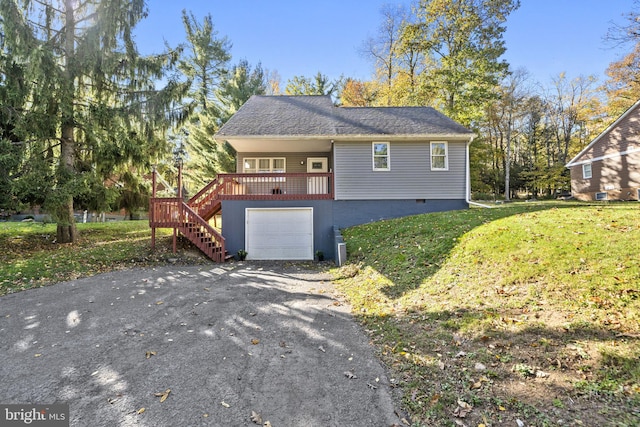 view of front property with a garage and a front lawn