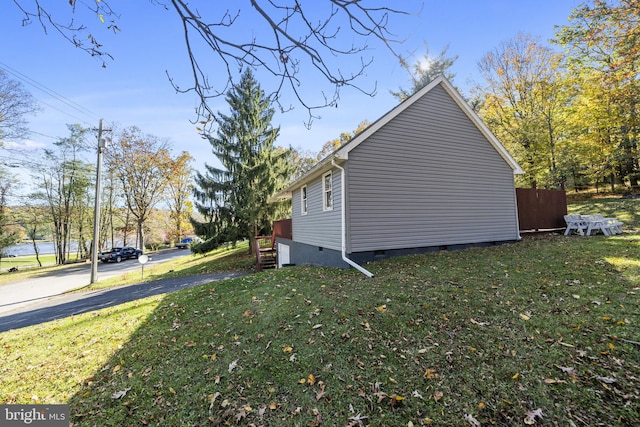 view of property exterior featuring a yard