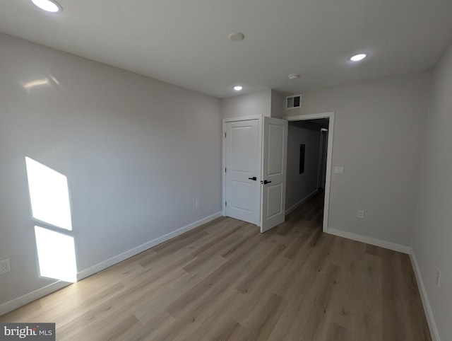 unfurnished bedroom featuring light wood-type flooring