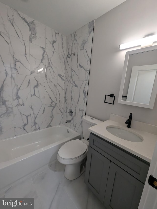 full bathroom with vanity, toilet, and tiled shower / bath combo