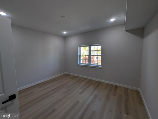 unfurnished room with light hardwood / wood-style flooring