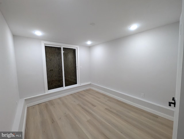 empty room with light wood-type flooring