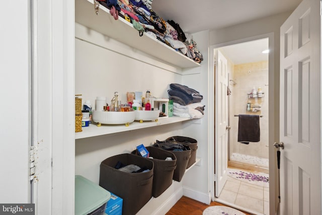 laundry room with hardwood / wood-style floors