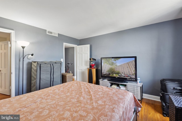 bedroom featuring wood-type flooring