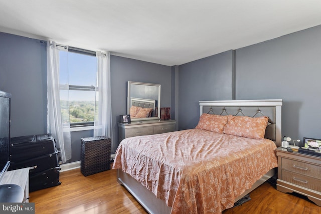 bedroom with light hardwood / wood-style flooring